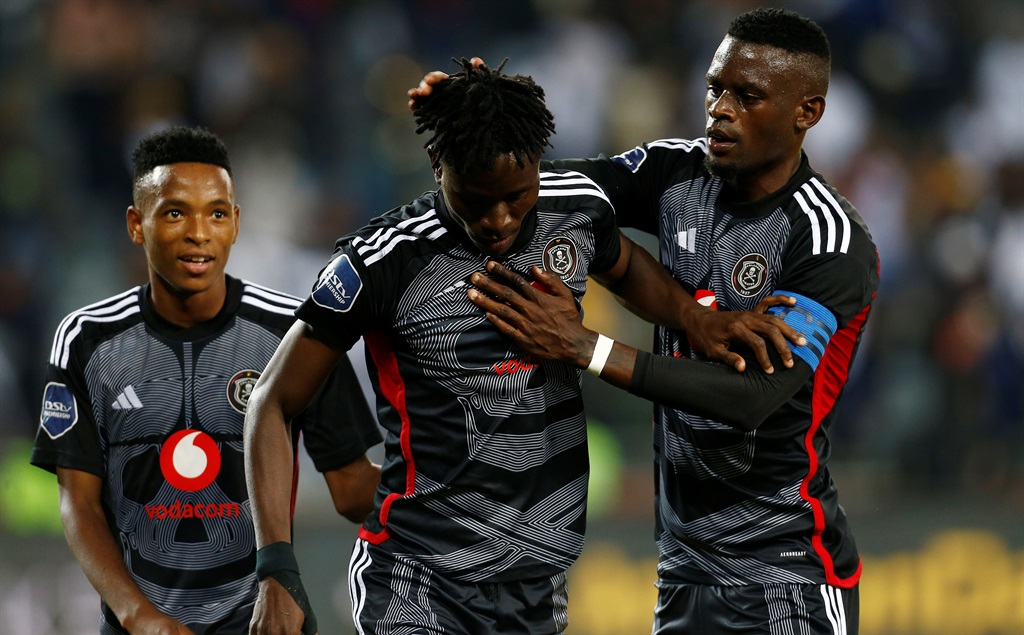 Karim Kimvuidi of Orlando Pirates celebrates his goal with Relebohile Mofokeng and Innocent Maela during the DStv Premiership match between Orlando Pirates and Golden Arrows at Orlando Stadium on April 06, 2024 in Johannesburg, South Africa.