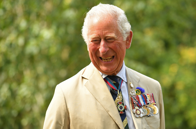 A jovial Prince Charles speaks to relatives of veterans during a national service of remembrance in Alrewas, England, in August to mark the 75th anniversary of VJ - Victory over Japan. (Photo credit: AFP/Gallo Images)