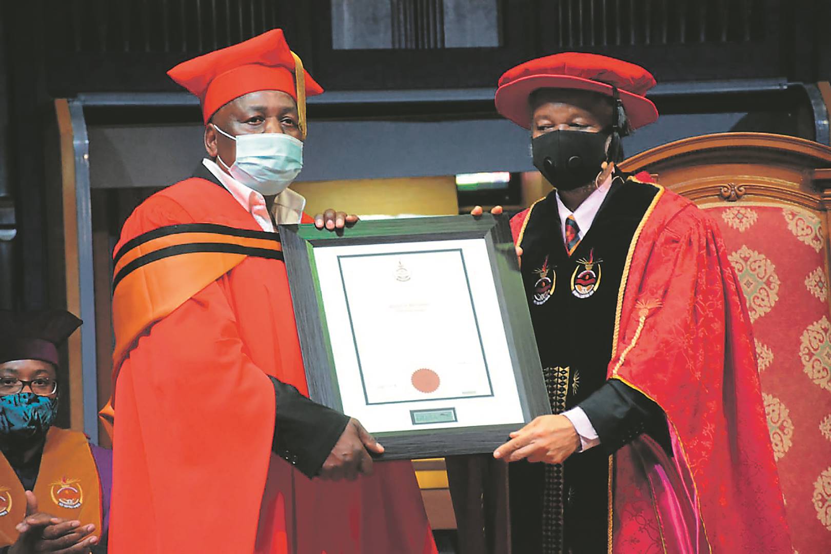 Moses Ngwenya (left) of the legendary group Soul Brothers received his honorary doctorate from Unisa Vice-Chancellor Professor Mandla Makhanya.                  Photo by Raymond Morare