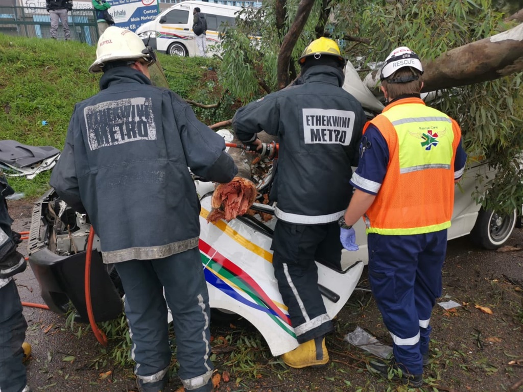 A taxi driver and passenger had to be rescued afte