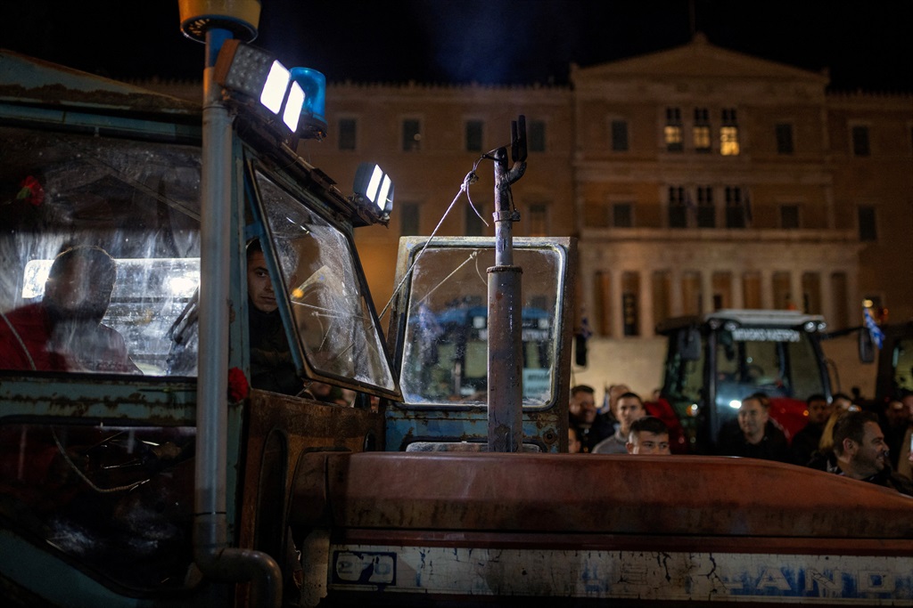 Greek farmers on a tractor take part in a protest 