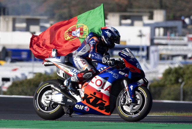 Miguel Oliveira of Portugal and Team KTM Tech 3 celebrates the victory with flag during the MotoGP race during the MotoGP of Portugal at Algarve Motor Park on November 22, 2020 in Portimao, Portugal. 