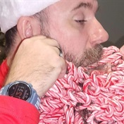 Joel earns his stripes and a world record for sticking 187 candy canes in his beard