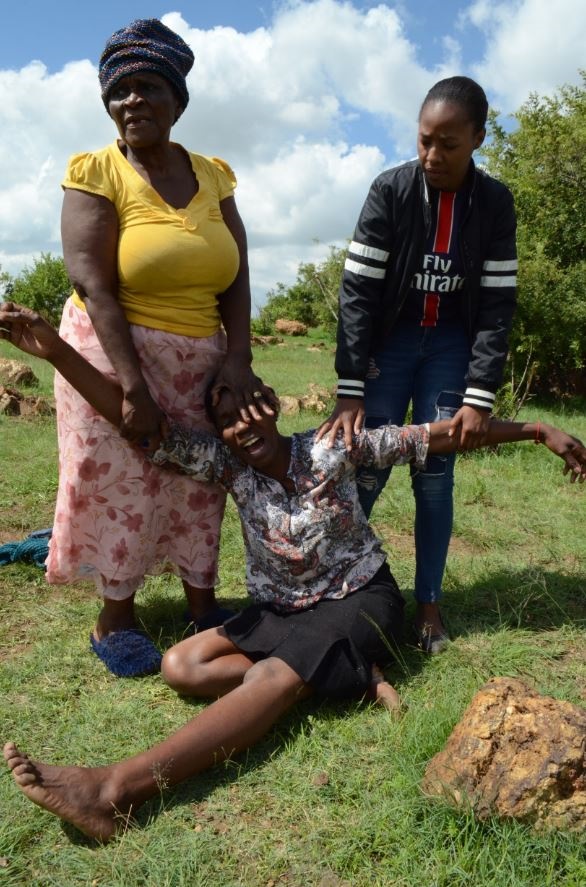 Anna Sediti a relative was hurt when she saw the body of Katleho Mokoenyane being recovered from the river. She was comforted by Thembi Nkosi and Khasu Motsidise.
Photo: Happy Mnguni.
