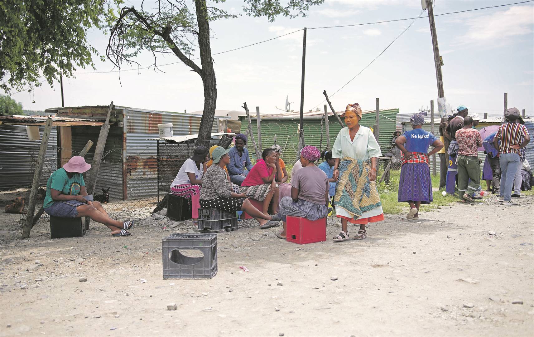 Residents of the Popo Molefe informal settlement, where gunmen opened fire on a group of people on December 16, killing nine and wounding eight others.