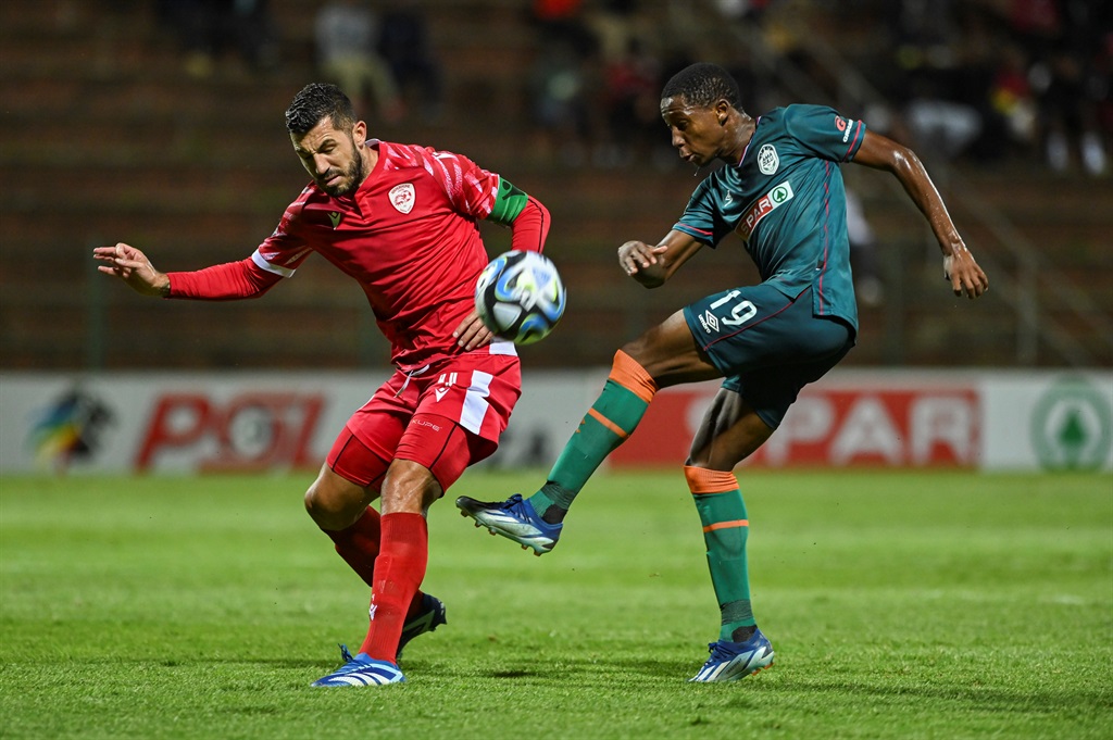 DURBAN, SOUTH AFRICA - DECEMBER 13: Daniel Cardoso, captain of Sekhukhune United and Tshepang Moremi of AmaZulu FC during the DStv Premiership match between AmaZulu FC and Sekhukhune United at King Goodwill Zwelithini Stadium, Durban on December 13, 2023 in Durban, South Africa. (Photo by Darren Stewart/Gallo Images),