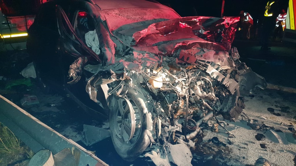 Car and taxi collide leaving one dead, at least eighteen injured.
