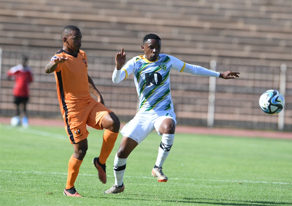 POLOKWANE, SOUTH AFRICA - MARCH 10: Oswin Appollis of Polokwane City and Nduduzo Mhlongo of Golden Arrows during the DStv Premiership match between Polokwane City and Golden Arrows at Old Peter Mokaba Stadium on March 10, 2024 in Polokwane, South Africa. (Photo by Philip Maeta/Gallo Images)