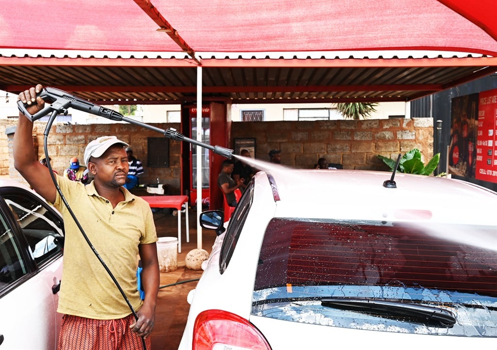 Street hustlers at Busy Corner Car Wash in Zola: P