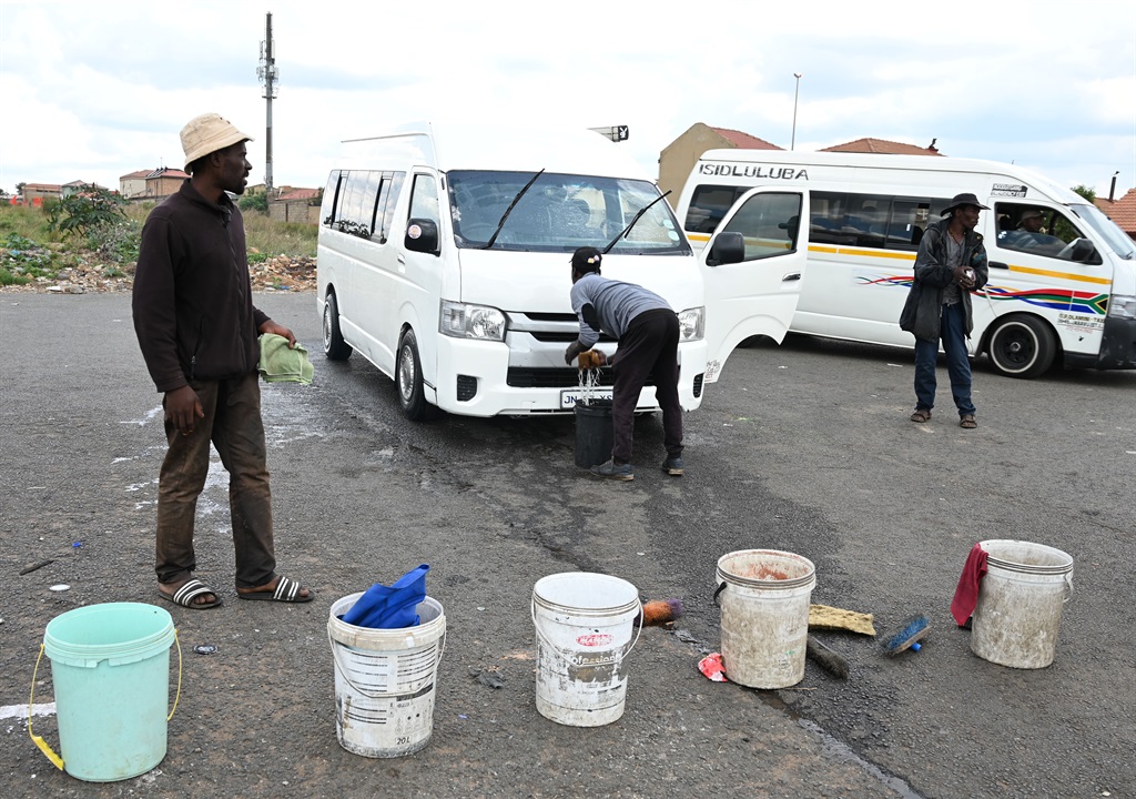 Street hustlers at Busy Corner Car Wash in Zola. Photo by Morapedi Mashashe