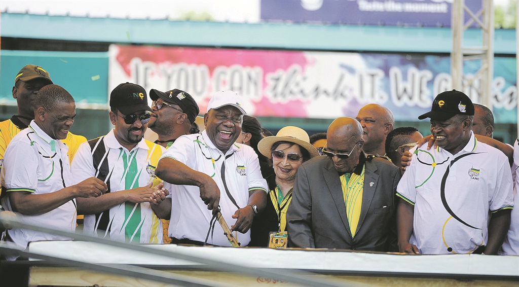 ANC President Cyril Ramaphosa(middle) cut the cake while flanked by ANC leaders during the partys 108th birthday celebration at the Tafel-Lager Park stadium in Kimberley in the Northern Cape, yesterday. Ethiopian Prime Minister Abiy Ahmed Ali on this left joined the festivities. Picture: Jabu Kumalo