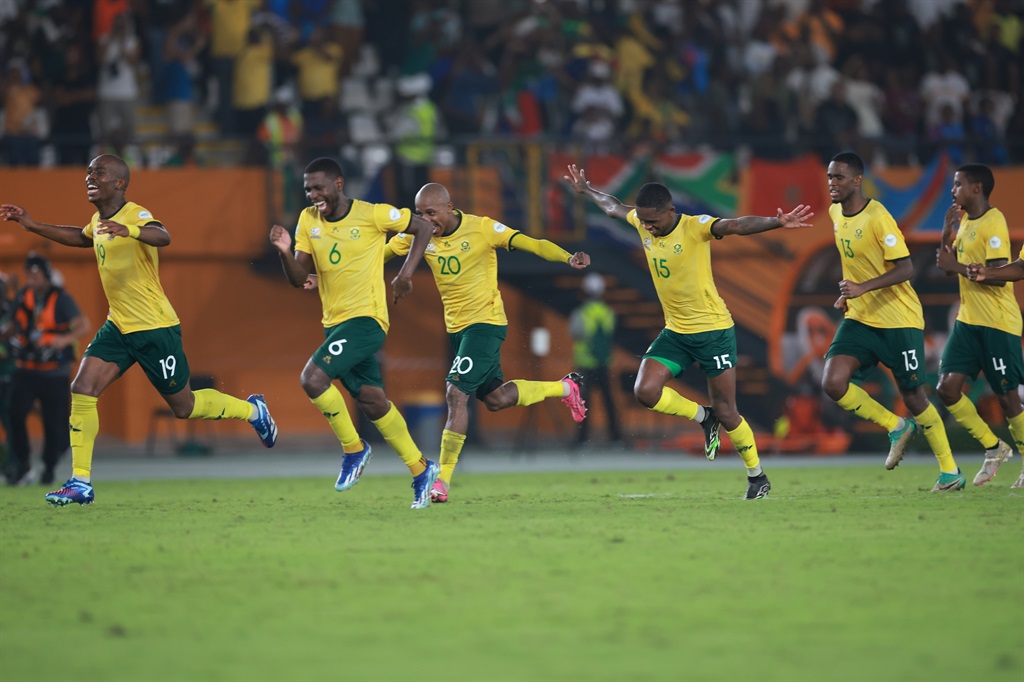 South African players celebrates after winning the penalty shoot out of the TotalEnergies CAF Africa Cup of Nations, 3rd Place Playoff match between South Africa and Democratic Republic Of Congo at Stade Felix Houphouet Boigny on February 10, 2024 in Abidjan, Ivory Coast. 