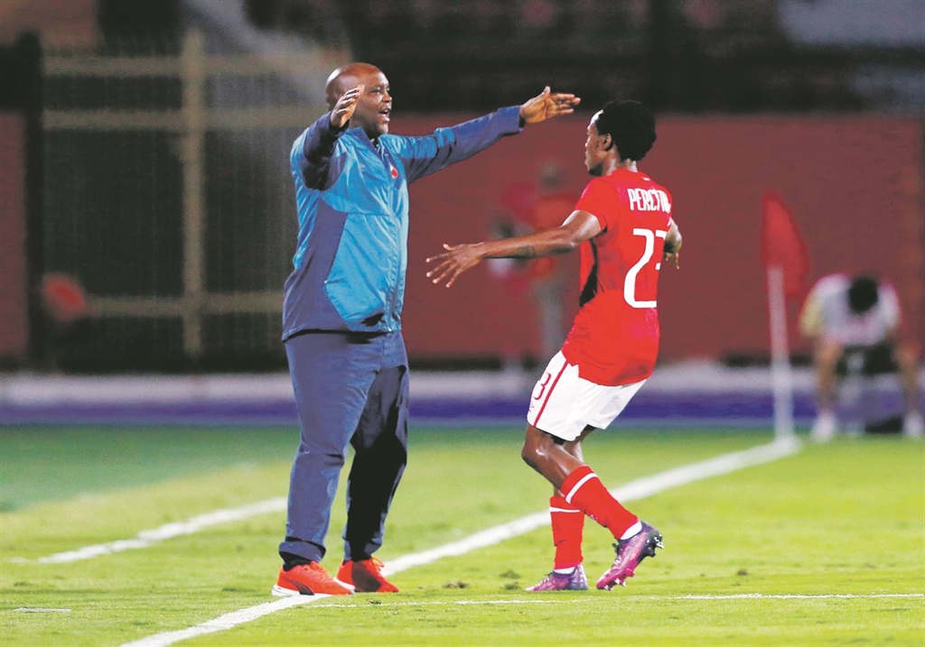 Coach Pitso Mosimane and Percy Tau during their short stint together at Al Ahly in Egypt. 