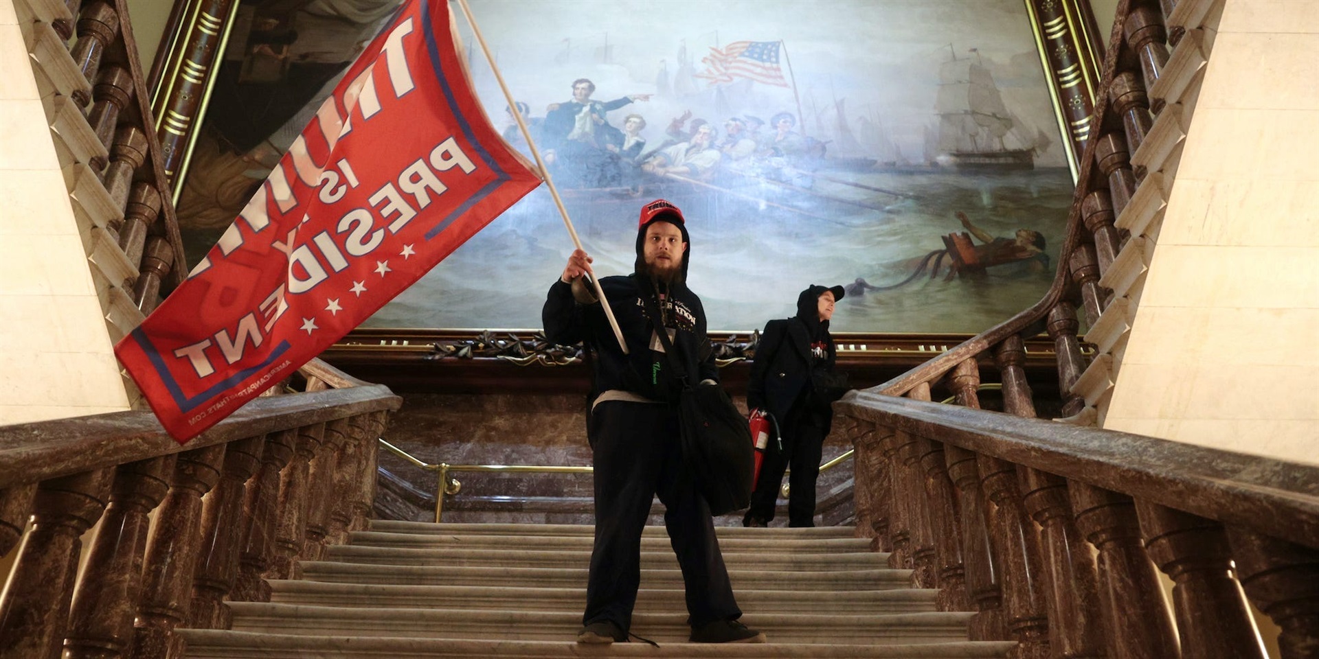 A protester holds a Trump flag inside the US Capitol Building near the Senate Chamber on January 6, 2021 in Washington, DC. 