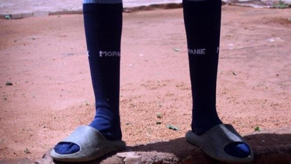 Kabelo Seanego wears long socks as ants are terrorising them. Photo by Thabo Monama