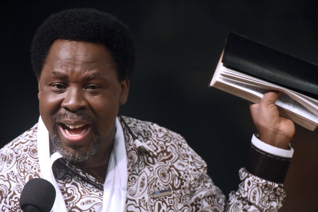 Nigerian pastor TB Joshua speaks during a New Year's memorial service for the South African relatives of those killed in a building collapse at his Lagos megachurch on December 31, 2014.