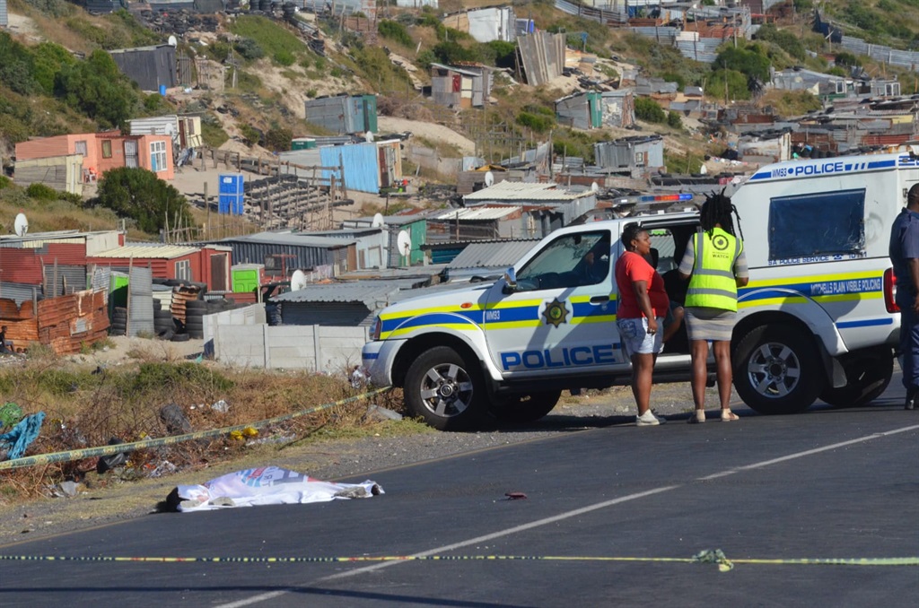 Cops at the scene on Swartklip Road where a young girl was hit by a car. Photo by Lulekwa Mbadamane