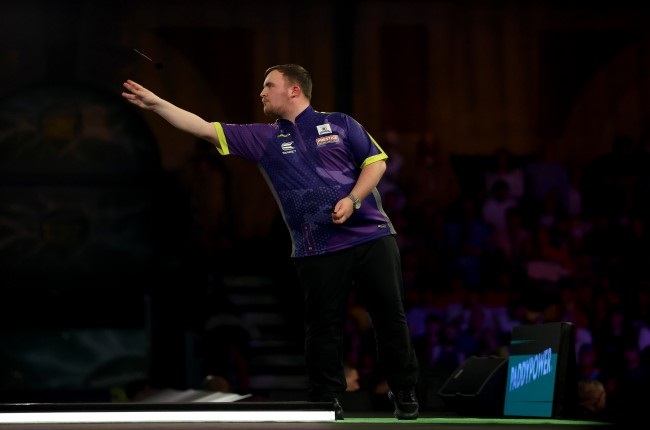 Sixteen-year-old Luke Littler of England throws during his semi final match against Rob Cross at the World Darts Championship at Alexandra Palace. (Photo by Tom Dulat/Getty Images)