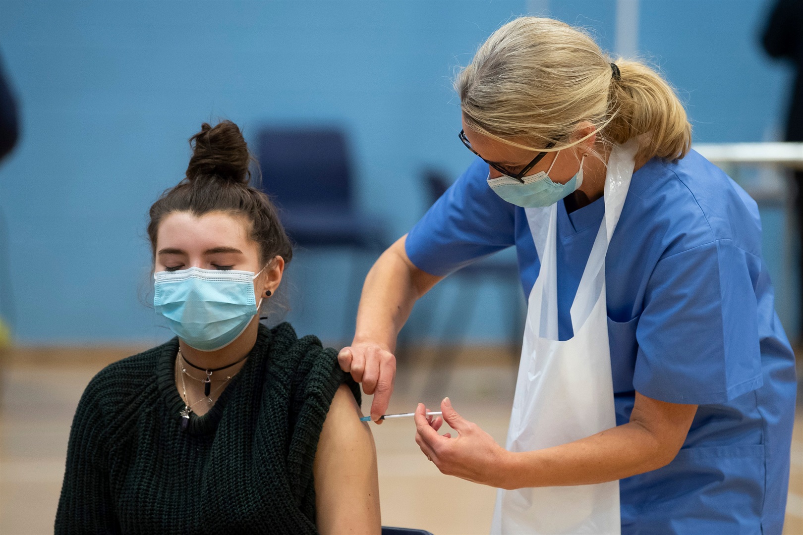 A woman receives the COVID-19 vaccine in Wales, UK. 