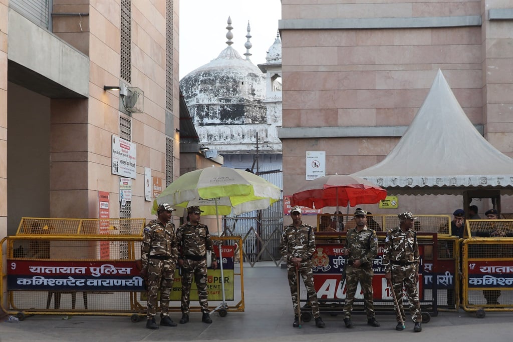 Police guard the Gyanvapi mosque in Varanasi on 31 January 2024, following a court ruling allowing Hindu worshippers – who believe the mosque replaced a destroyed temple to the deity Shiva – to pray in the buildings basement. (Photo by Niharika KULKARNI / AFP)