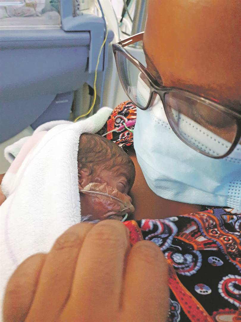 Mother, Nosipho Nkatini, meets and holds baby Oyena for the first after giving birth to him three weeks ago at Netcare N1 City Hospital in Goodwood. Photo Supplied