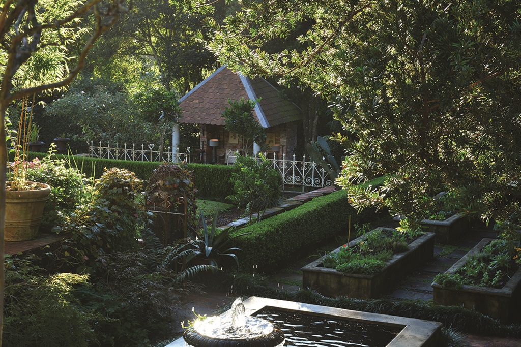 Lining up with the front steps, the charming Croquet House with its shingled roof was inspired by old Maritzburg architecture; craftsman and builder Tim Eddie undertook this project for the couple. Photo: Kim Thunder