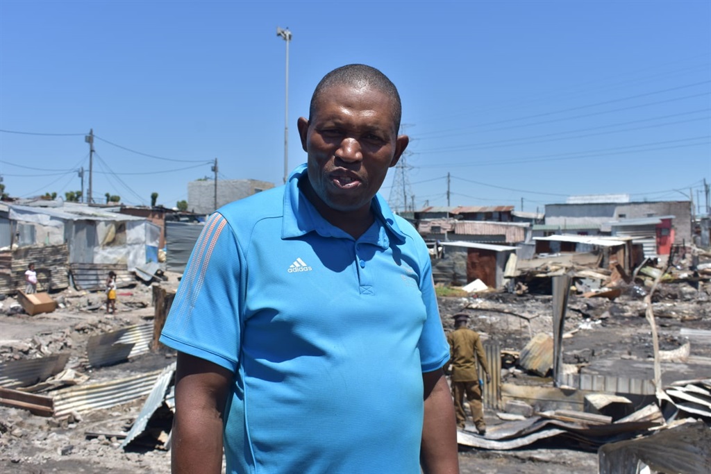 Mandla Wonke, a community leader from Nyhunyhwini squatter camp in Philippi Browns Farm in Cape Town said they are grateful to motorists who donated money to them. Photo by Buziwe Nocuze