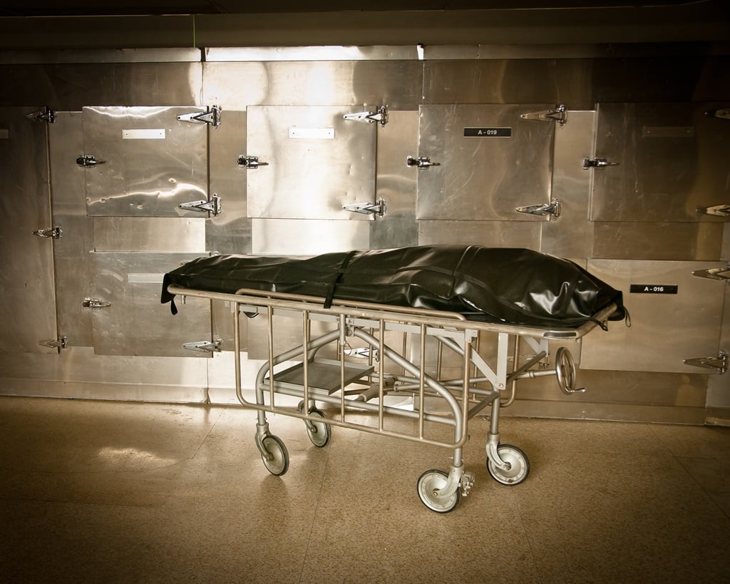 Body bag in a hospital morgue in black and white. (Image: Getty)