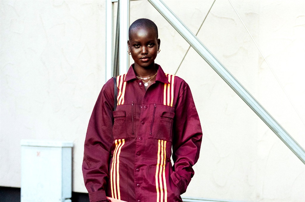 Model Adut Akech wears a maroon adidas x IVY PARK tracksuit, white Adidas sneakers after the Alberta Ferretti show during Milan Fashion Week Fall/Winter 2020-2021 on February 19, 2020 in Milan, Italy. (Photo by Melodie Jeng/Getty Images)