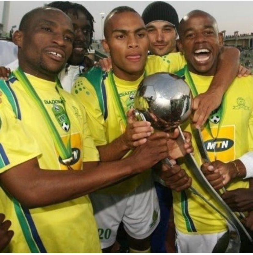 Robyn Johannes (centre) celebrates the Nedbank Cup title with Surprise Moriri and Esrom Nyandoro (right).