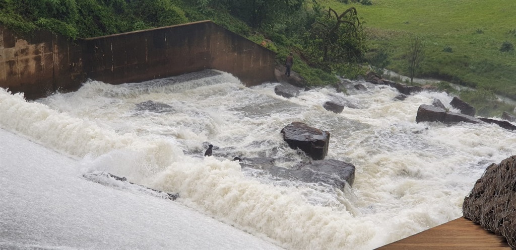 A man has been hailed as a hero after rescuing a dog from the middle of a fast-flowing torrent in the Drakensberg.