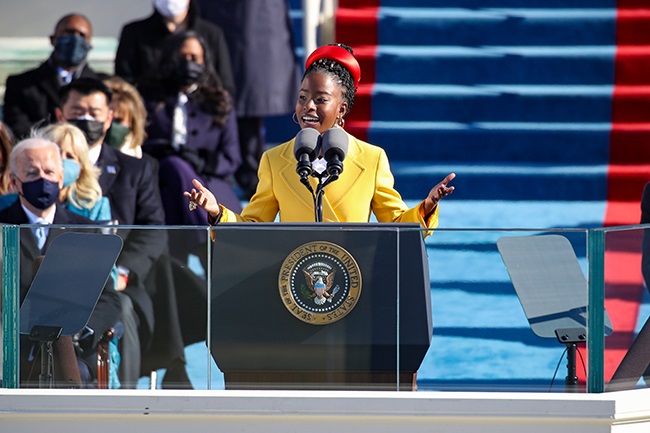 Youth Poet Laureate Amanda Gorman speaks at the inauguration of U.S. President Joe Biden on the West Front of the U.S. Capitol on 20 January 2021 in Washington, DC. (Photo by Rob Carr/Getty Images)