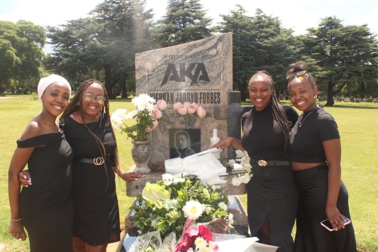 From left: Masego Modisane, Mmabatho Sibeko, Ntebogeng Serongwane and Tshegofatso Mofokeng remembering the late rapper AKA at Westpark Cemetery, Joburg. Photo by Phuti Mathobela