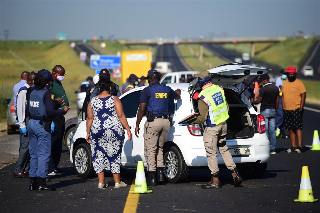 A full load of illegal immigrants who were found in a taxi being arrested at the O Kae Molao operation on the Border of Gauteng and Mpumalanga N12 freeway. Photo by Trevor Kunene