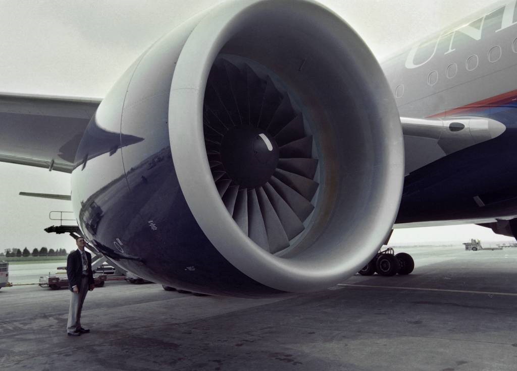 An inspector for Pritt and Whitney engines, checks a United Airlines Boeing 777.