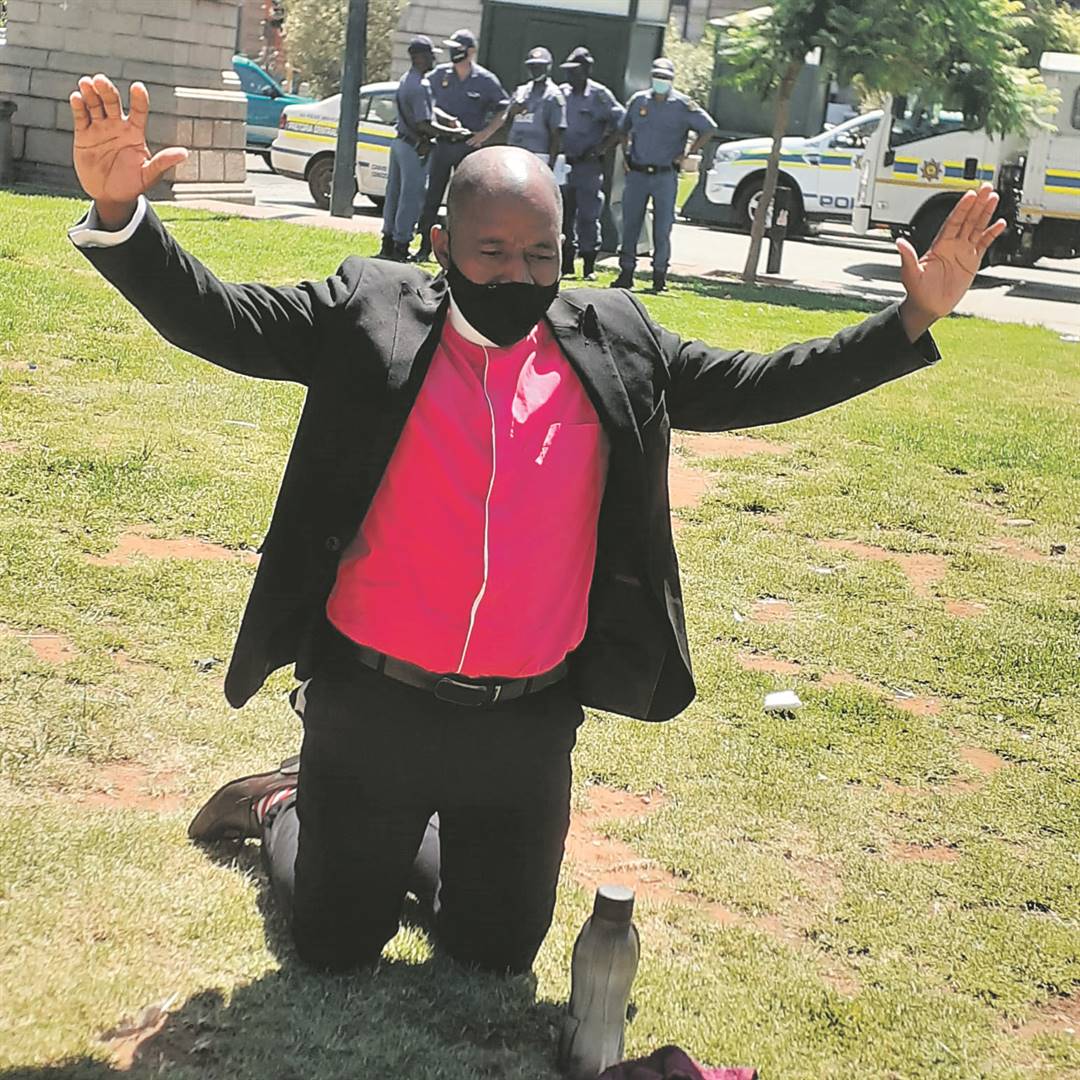A pastorprays for the unbanning of churches at Church Square in Tshwane on Friday.  Photo by   Karabo Rammutla