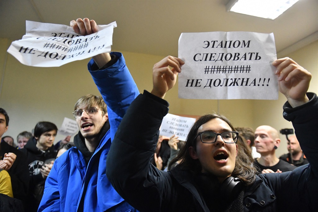 Supporters react to the 7-year sentence handed to Russian artist Alexandra Skochilenko, accused of spreading disinformation about the Russian army for changing supermarket price tags with messages criticising Russias military offensive in Ukraine, in November 2023. France's Viginum agency says a "Portal Kombat" group of Russian websites deal in misinformation aimed at countries supporting Ukraine. (Photo by Olga MALTSEVA / AFP)