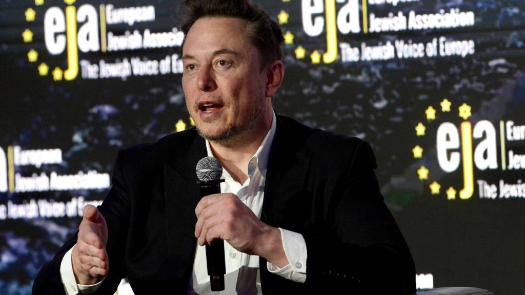 Elon Musk attends a symposium on 'Antisemitism Onl