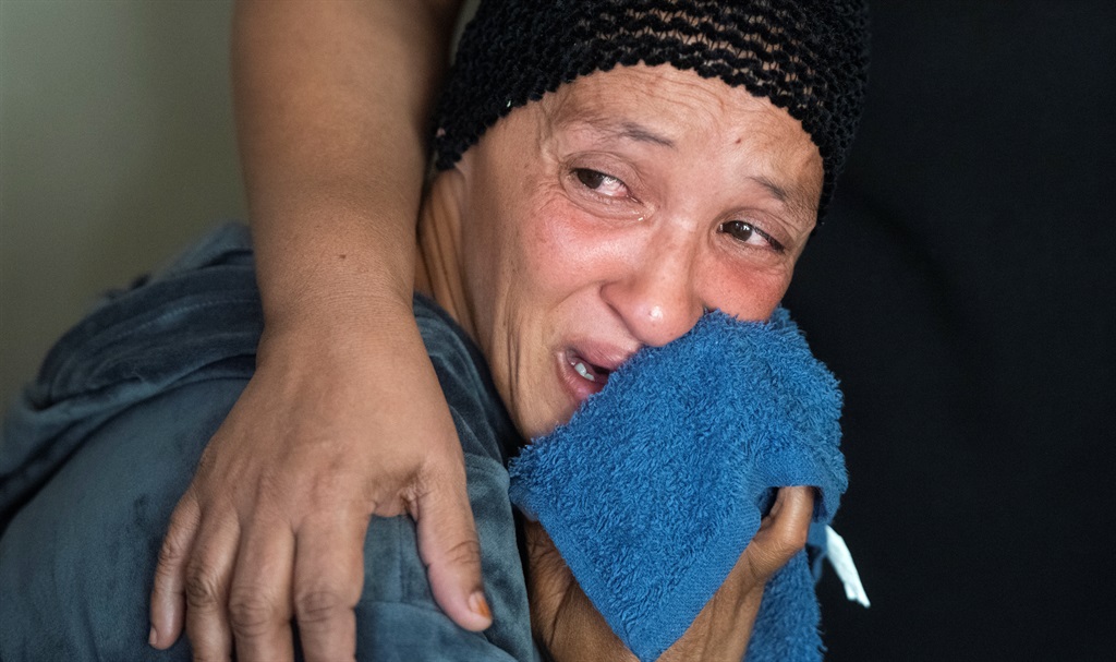 Samantha Mitchell, mother of Tamir Rao Mitchell (13) who was killed during a drive by shoot out reacts with emotion on February 26, 2021 in Mitchells Plain.  