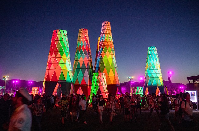 Festival goers gather and walk around Sarbale ke during the 2019 Coachella Valley Music and Arts Festival.