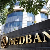 Nedbank ups dividend on solid results even as impairments jump 30%