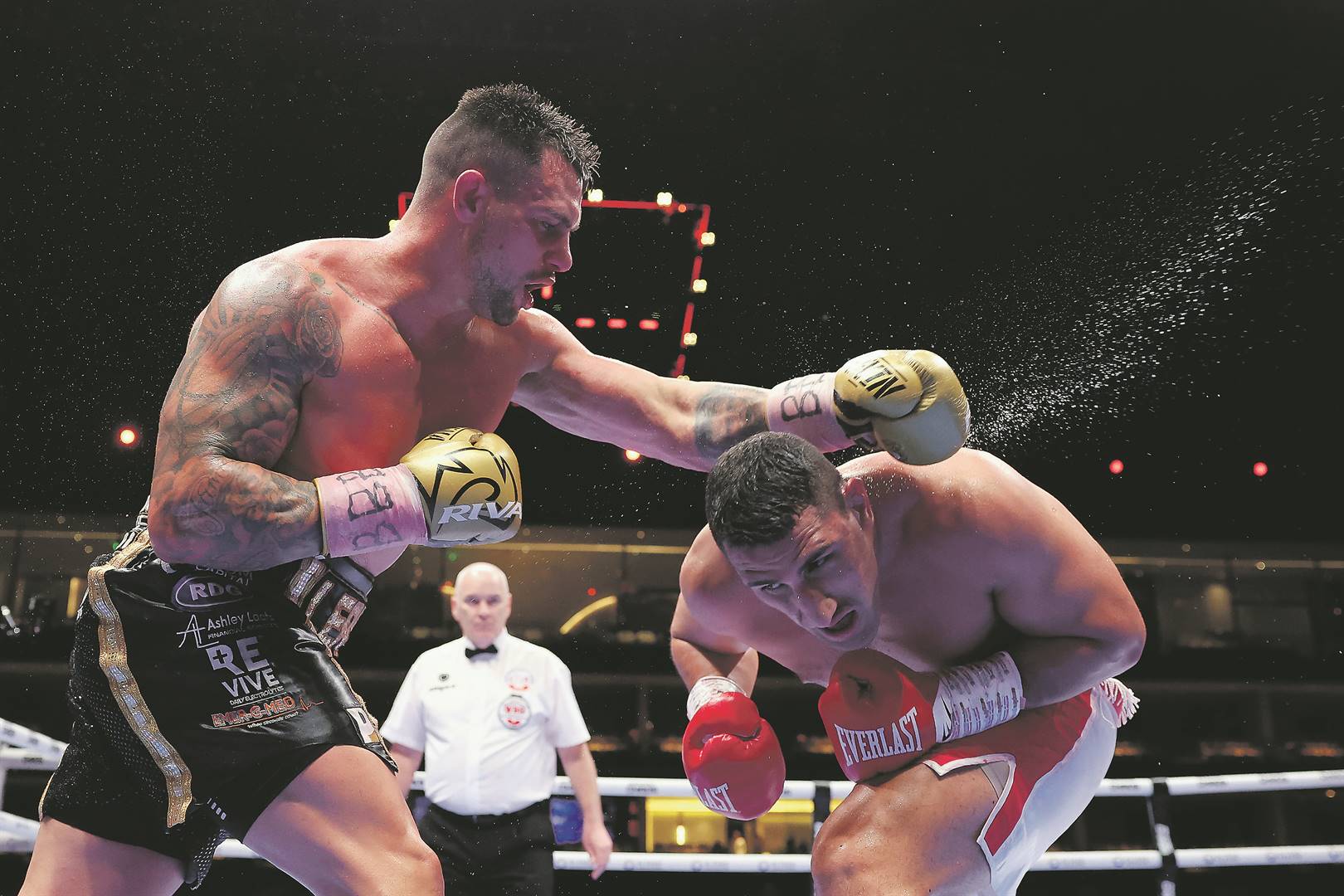 Australian Justis Huni dodges a punch from Kevin Lerena during their WBO Global Heavyweight title at the Kingdom Arena in Riyadh, Saudi Arabia.