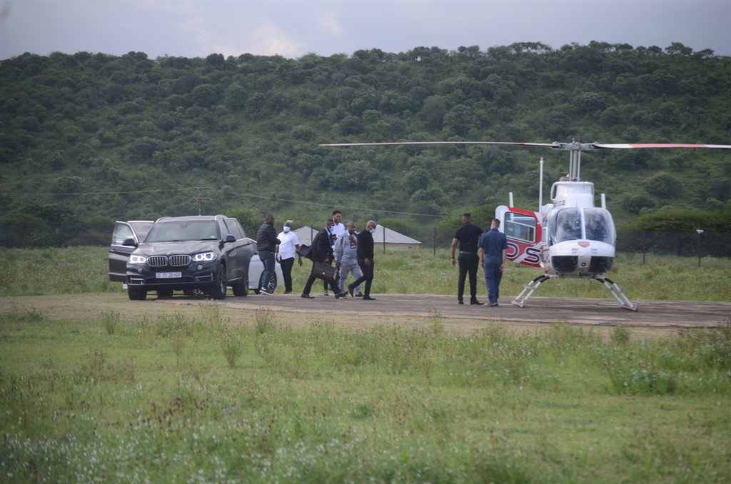Malema and his team go to the chopper after their meeting with Zuma. 