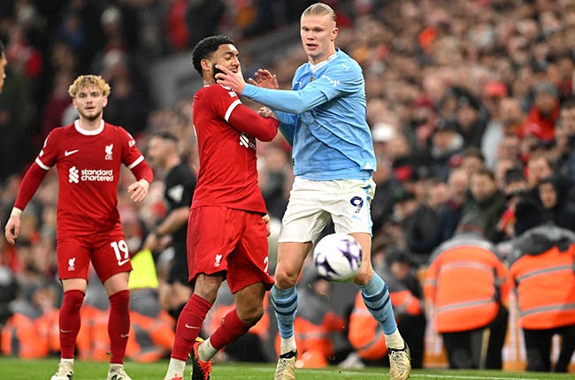 Joe Gomez of Liverpool and Erling Haaland of Manchester City clash at Anfield on 10 March (Michael Regan/Getty Images)