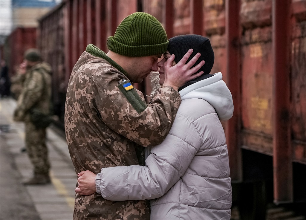 Ukrainian serviceman says goodbye to his wife who 