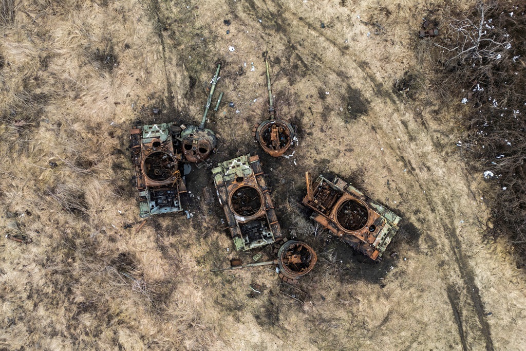 Destroyed Russian tanks are seen near the village 