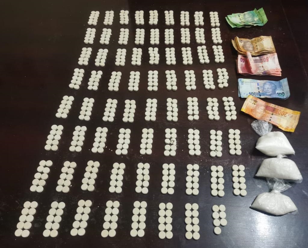 Mandrax tablets, tik and cash found by police.