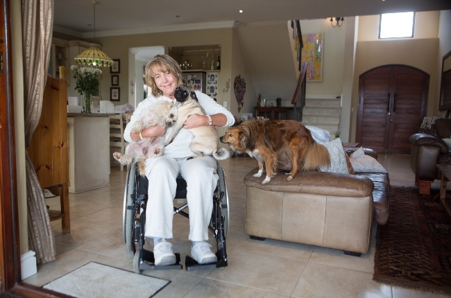 Soozie Dinnie who's been paralyzed for six years says her dogs Goose, Miss Poppy and Miss Pipps, have made lockdown easier for her (Photo: YOU/Misha Jordaan)