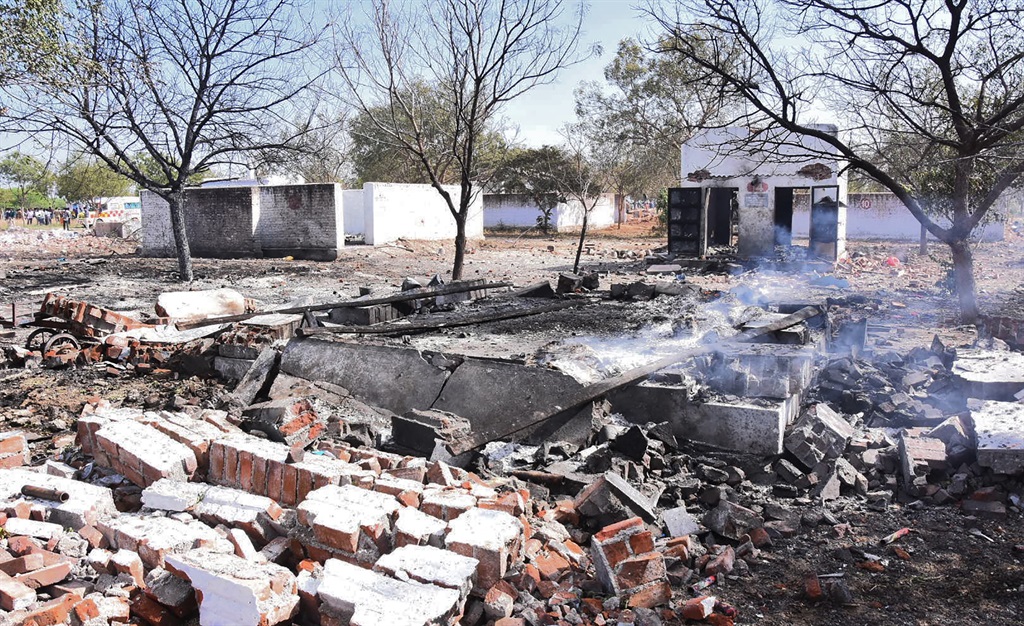 This picture was taken on 12 February 2021 smoke billows from the remains of a firecracker factory near Sattur in Virudhunagar district of Tamil Nadu state.