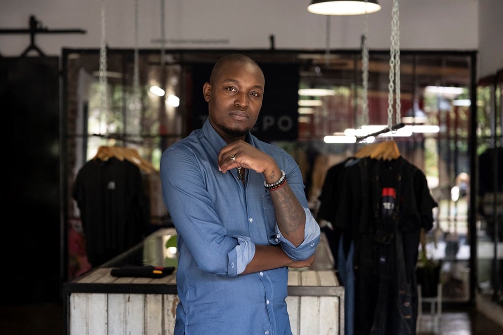 Tshepo Mohlala, founder of Tshepo Jeans, poses for a photograph at his workshop in Johannesburg on 30 January 2024.